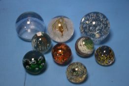 NINE GLASS PAPERWEIGHTS