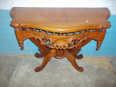 A SERPENTINE FRONTED ORNATE HALL TABLE (SOME DAMAGE BUT FIXABLE)