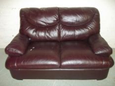 A TWO SEATER LEATHER SOFA