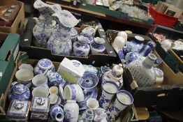 THREE TRAYS OF BLUE & WHITE CHINA INCLUDING STAFFORDSHIRE DOGS, VASES, TEAPOTS, URNS, PLATES ETC.