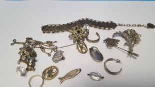 A BAG OF WHITE METAL JEWELLERY