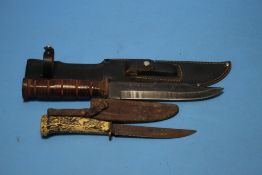 A BOWIE TYPE KNIFE IN SHEATH TOGETHER WITH ANOTHER (2)