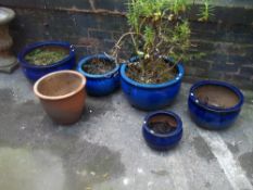 SIX GLAZED PLANT POTS
