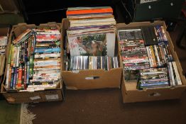 FOUR BOXES TO INCLUDE DVDS AND RECORDS TO INCLUDE DIANA ROSS, ETC. AND A BOX OF NEWSPAPERS AND