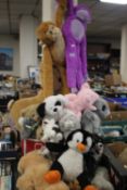 A LARGE QUANTITY OF SOFT TOYS TO INCLUDE MONKEYS, TEDDIES, DOGS ETC.