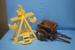 A WOODEN MODEL OF A FAIRGROUND RIDE TOGETHER WITH A WOODEN CART (2)