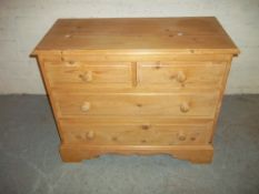 A RAW PINE THREE DRAWER CHEST