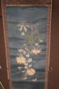 AN ORIENTAL SCROLL WITH EMBROIDERED DECORATION OF FLOWERS AND BUTTERFLIES, together with a painted