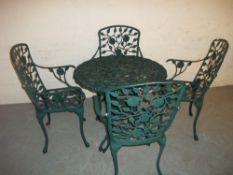 A CAST ALUMINIUM PATIO / GARDEN TABLE AND FOUR CHAIR SET A/F - ONE ARM MISSING AND DAMAGE TO TABLE