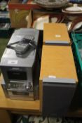 A PANASONIC CD STEREO SYSTEM WITH SPEAKERS AND REMOTE A/F