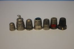 SEVEN SILVER AND WHITE METAL THIMBLES