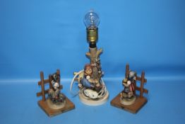 A GOEBEL LAMP TOGETHER WITH A PAIR OF GOEBEL FIGURES (3)
