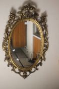 A DECORATIVE MIRROR, APPROX. 85 X 56 CM