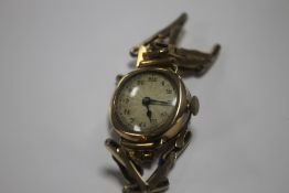 A 9 CT GOLD CASED LADIES WRIST WATCH