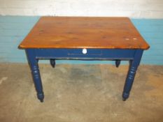 A SCRUB TOP TABLE WITH BLUE LEGS