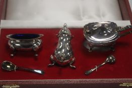 A HALLMARKED SILVER CRUET SET