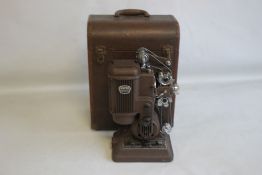 A SIMPLEX AMPRO LTD. IMPERIAL MODEL FILM PROJECTOR, in original fitted carry case, not tested