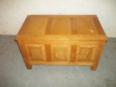 A SOLID OAK RAISED AND FIELDED PANNELLED MODERN BLANKET CHEST OTTOMAN