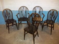 A SET OF FIVE REPRODUCTION WHEEL BACKED DINING CHAIRS TO INCLUDE TWO CARVERS