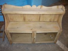 AN ANTIQUE PINE HANGING WALL DISPLAY UNIT (STRIPPED)