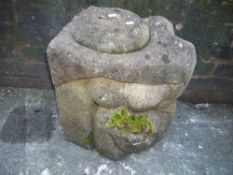A STONE FIGURE OF A KNEELING NAKED LADY IN HENRY MOORE STYLE
