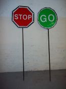 A PAIR OF VINTAGE STOP/GO ROAD WORK LOLLIPOP SIGNS