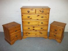 THREE PINE CHESTS OF DRAWERS COMPRISING A FIVE DRAWER CHEST AND TWO, TWO DRAWER CHESTS WITH PULL OUT