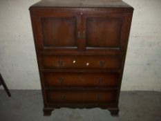 AN OAK TALLBOY WITH THREE DRAWERS