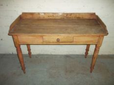 AN ANTIQUE STRIPPED PINE WASH STAND / DESK