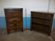 AN OAK REPRODUCTION LINENFOLD DRINKS CABINET AND A BOOKCASE
