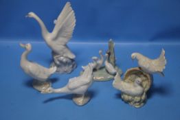 FOUR NAO GEESE FIGURES TOGETHER WITH A FIGURE OF TWO DOVES.