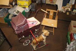 A COACH BUILT DOLLS PRAM with bedding and cover, together with a push-along dog and a 1950s child'