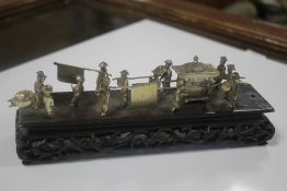 A CONTINENTAL SILVER ORIENTAL FIGURE GROUP WITH SEDAN CHAIR, including base L 17.5 cm, W 5 cm,