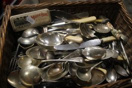 A BASKET OF ASSORTED CUTLERY