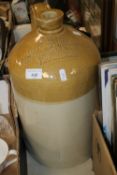 A LARGE STONEWARE FLAGON JOHN G. BAKER WINE & SPIRIT MERCHANT, PERSHORE