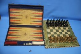 A CHESS SET TOGETHER WITH A BACKGAMMON SET