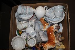 A SELECTION OF CHINA DOG ORNAMENTS, LADY FIGURINES, TEASET, VASES ETC.