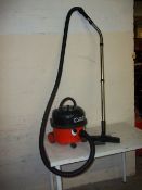 A HENRY HOOVER WITH ATTACHMENT