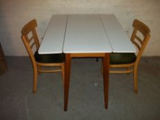 A RETRO FORMICA DROP LEAF KITCHEN TABLE AND TWO CHAIR DINING SET