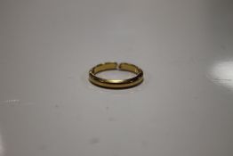 A YELLOW METAL RING