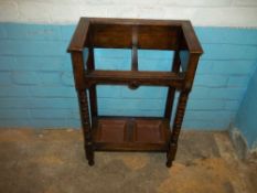 AN EDWARDIAN UMBRELLA HALL STAND IN OAK