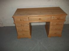 A RAW PINE TWIN PEDESTAL DESK
