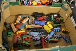 A COLLECTION OF MODEL TRAINS AND CARRIAGES TO INCLUDE 'THOMAS THE TANK ENGINE' TYPE (TRAY NOT