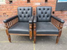 A PAIR OF EDWARDIAN OAK LIBRARY ARMCHAIRS WITH TURNED SUPPORTS (2) A/F