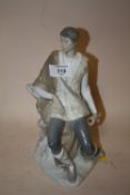 A VINTAGE LLADRO FIGURE OF A SEATED GENTLEMAN WITH IMPRESSED BACK STAMP