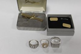 THREE SILVER DRESS RINGS WITH A PAIR OF STRATTON CUFFLINKS AND A TIE CLIP