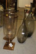 A PAIR OF LARGE DECORATIVE CANDLE HOLDERS H-51CM, TOGETHER WITH TWO LARGE DECORATIVE GLASS BOTTLES