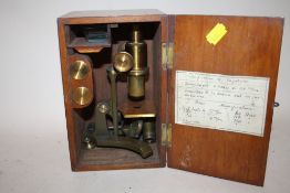 A BOXED VINTAGE BRASS MICROSCOPE