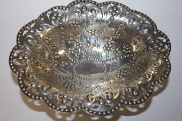 A HALLMARKED SILVER EMBOSSED BOWL ON LEGS - APPROX WEIGHT 140.1G