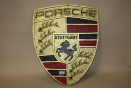 ***A LARGE ALUMINIUM PORSCHE PLAQUE, H 57 CM, W 46.5 CM**